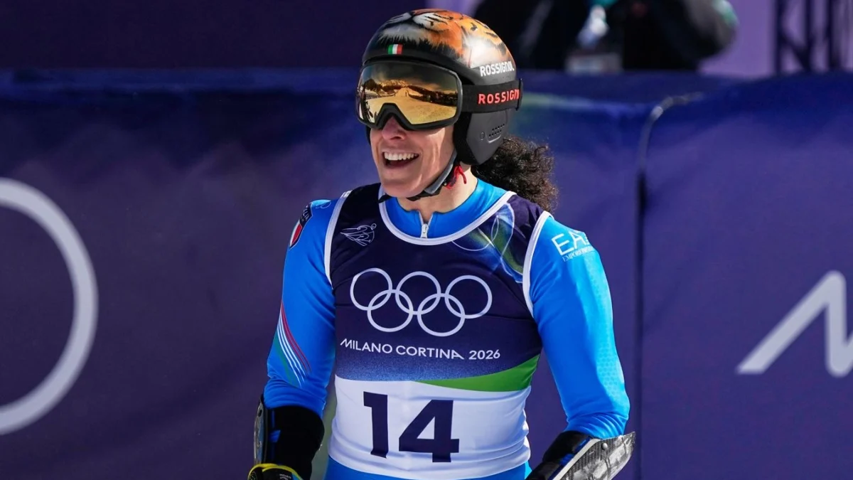 La cronaca dei Giochi Olimpici Invernali del 15 febbraio 2026: Brignone vince la medaglia d'oro nello slalom gigante. Lisa Vittozzi oro nell'inseguimento del biathlon. Snowboard cross misto: argento Italia. Fondo, Italia di bronzo nella staffetta maschile — corriere.it
