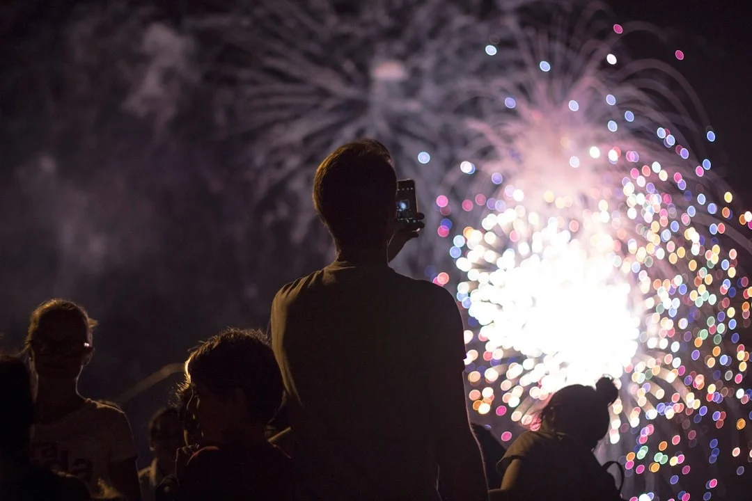 Unsplash - man taking picture of firecracker - 30/12/2025